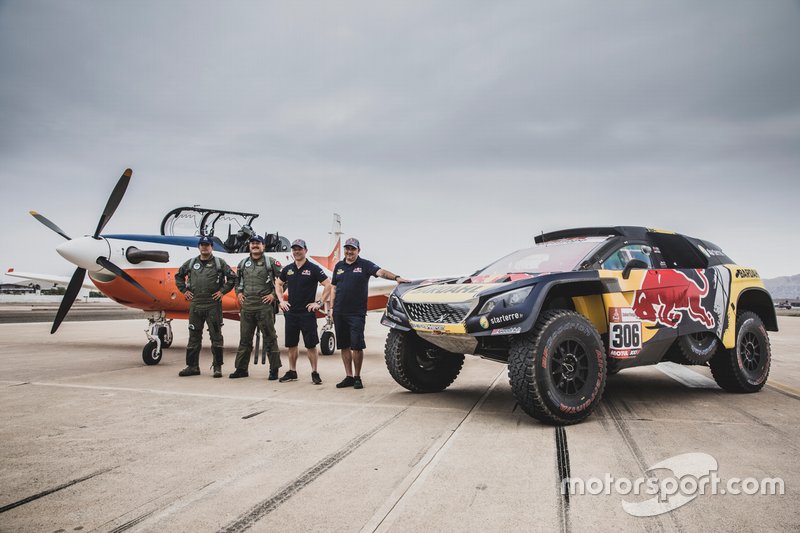 Sebastien Loeb and Daniel Elena of PH Sport after a race with an airplane before the Rally Dakar