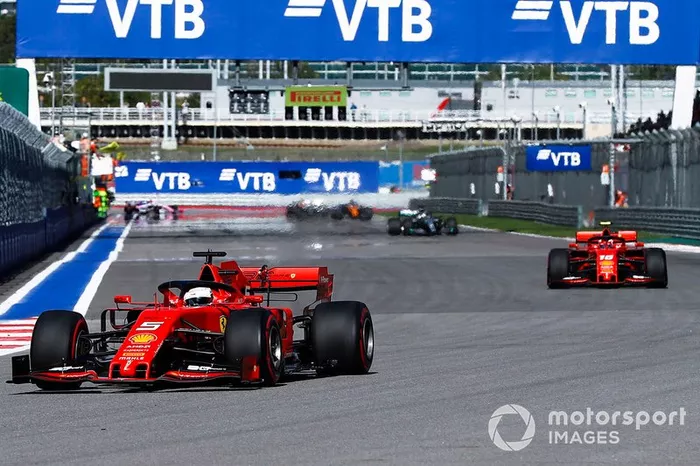 Sebastian Vettel, Ferrari SF90, leads Charles Leclerc, Ferrari SF90