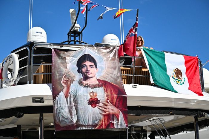 A banner representing Ferrari's Monegasque driver Charles Leclerc as a Saint