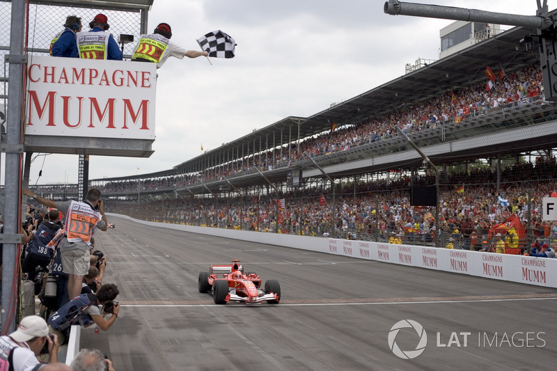 Michael Schumacher, Ferrari F2005 crosses the finish