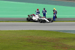 Lance Stroll, Williams FW40, climbs from his car after stopping on track