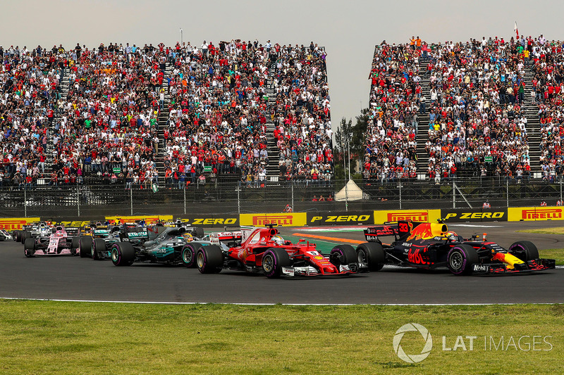 Max Verstappen, Red Bull Racing RB13 leads at the start of the race and collides with Sebastian Vettel, Ferrari SF70H