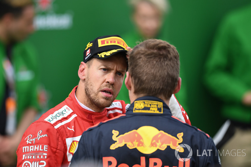 Sebastian Vettel, Ferrari and Max Verstappen, Red Bull Racing in parc ferme