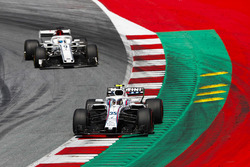 Sergey Sirotkin, Williams FW41, leads Marcus Ericsson, Sauber C37