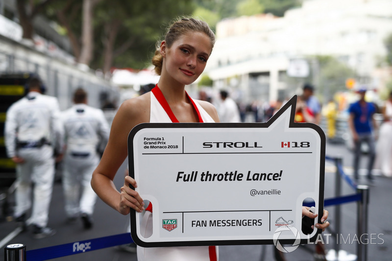 A grid girl holds a message for Lance Stroll, Williams Racing