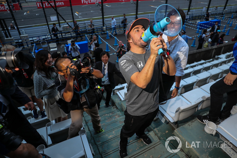 Fernando Alonso, McLaren talks to the fans using a megaphone