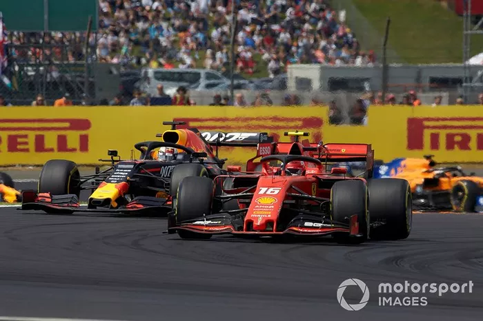 Charles Leclerc, Ferrari SF90, leads Max Verstappen, Red Bull Racing RB15