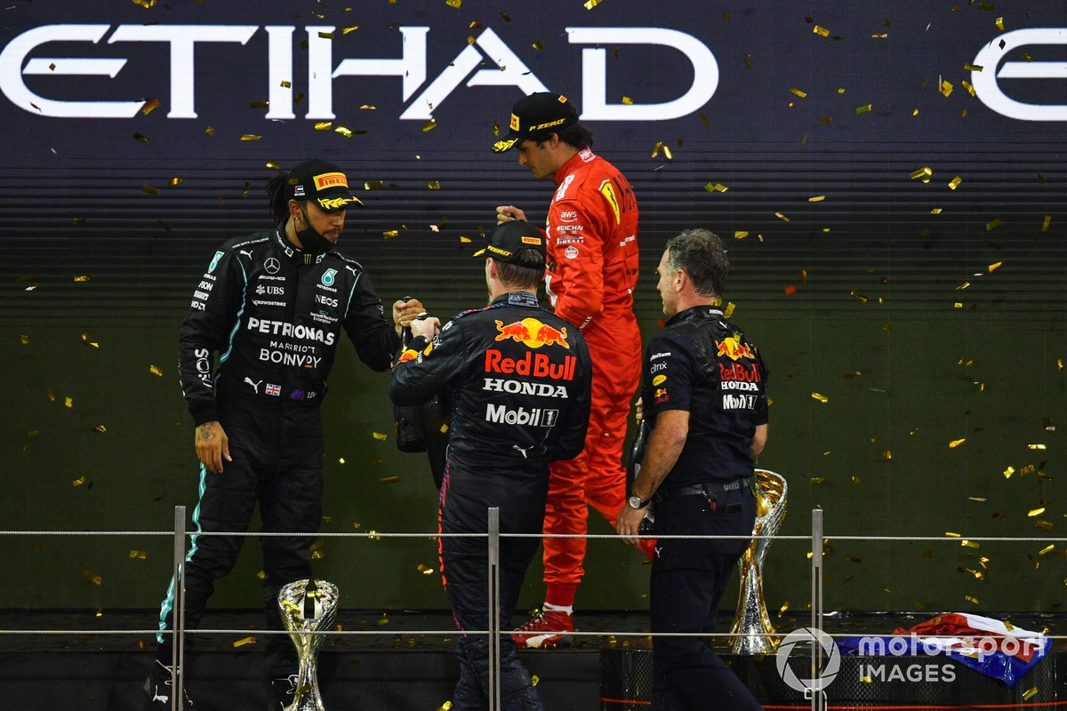 Lewis Hamilton, Mercedes, 2nd position, Max Verstappen, Red Bull Racing, 1st position, Carlos Sainz Jr., Ferrari, 3rd position, Christian Horner, Team Principal, Red Bull Racing, celebrate on the podium