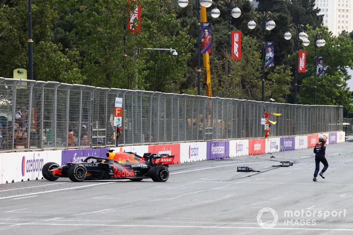 Max Verstappen, Red Bull Racing, climbs out of his car after crashing out from the lead