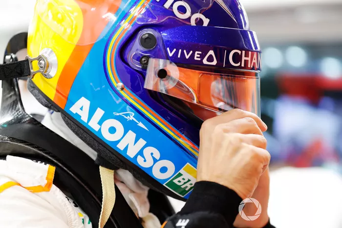 Fernando Alonso, McLaren puts on his helmet in the garag