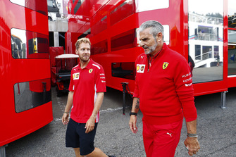 Sebastian Vettel, Ferrari, walks with Maurizio Arrivabene, Team Principal, Ferrari