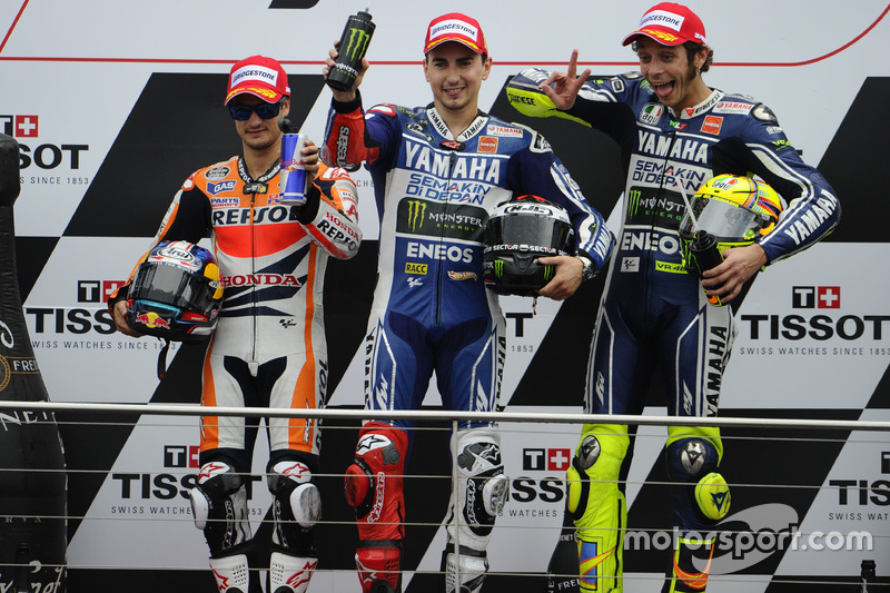 Podium: second place Dani Pedrosa, Repsol Hona; Race winner Jorge Lorenzo, Yamaha; third place Valentino Rossi, Yamaha