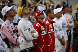 The drivers stand for the national anthem