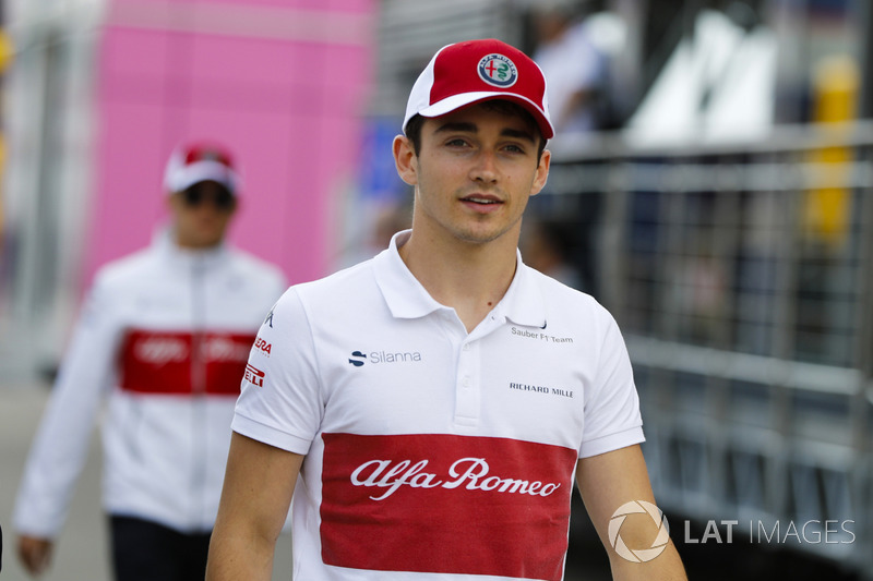 Charles Leclerc, Sauber, walks ahead of Marcus Ericsson, Sauber