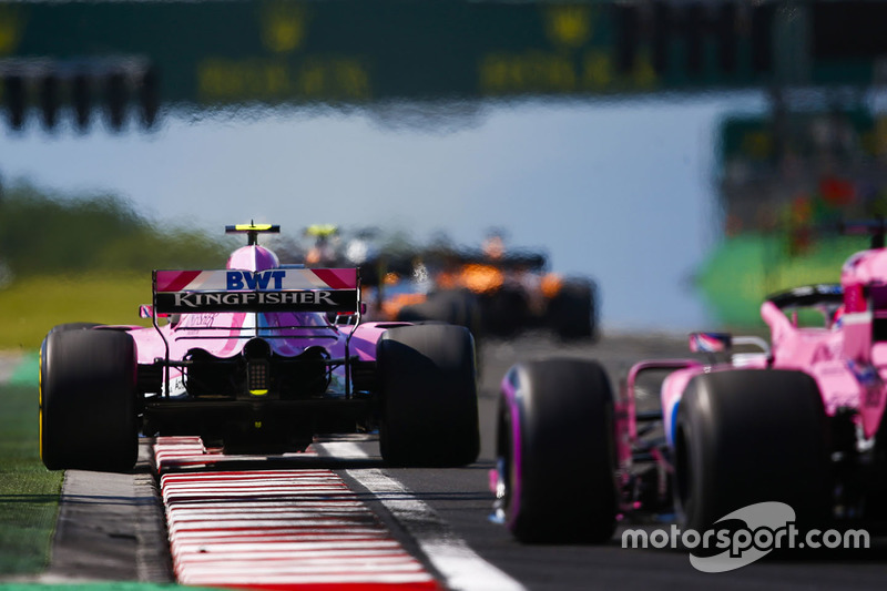 Esteban Ocon, Force India VJM11, leads Sergio Perez, Force India VJM11