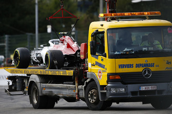 The car of Charles Leclerc, Sauber C37, is returned to the pits on a truck
