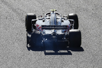 Kevin Magnussen, Haas F1 Team VF-18, with his rear tyre burst after connecting with Charles Leclerc, Sauber C37