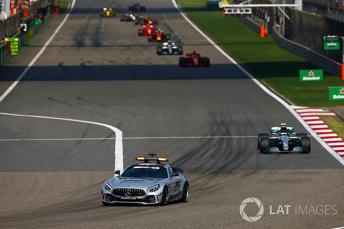 The AMG Mercedes safety-car leads Valtteri Bottas, Mercedes AMG F1 W09, Sebastian Vettel, Ferrari SF71H, Lewis Hamilton, Mercedes AMG F1 W09, and Max Verstappen, Red Bull Racing RB14 Tag Heuer