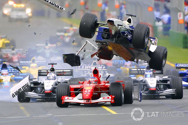 First corner accident: Ralf Schumacher, Williams flying over Rubens Barrichello, Ferrari