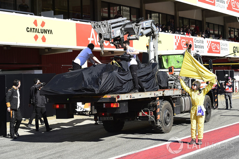 The car of Fernando Alonso, McLaren MCL33 is recovered to the pits