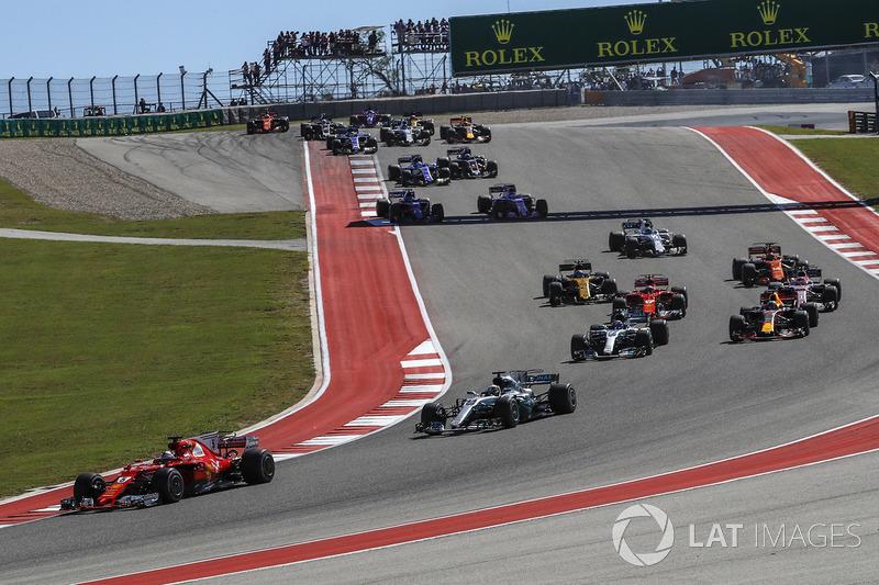 Sebastian Vettel, Ferrari SF70H leads Lewis Hamilton, Mercedes-Benz F1 W08 at the start of the race
