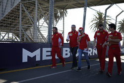 Sebastian Vettel, Ferrari and Maurizio Arrivabene, Ferrari Team Principal walk the track