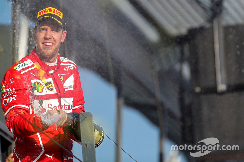 El ganador Sebastian Vettel, Ferrari