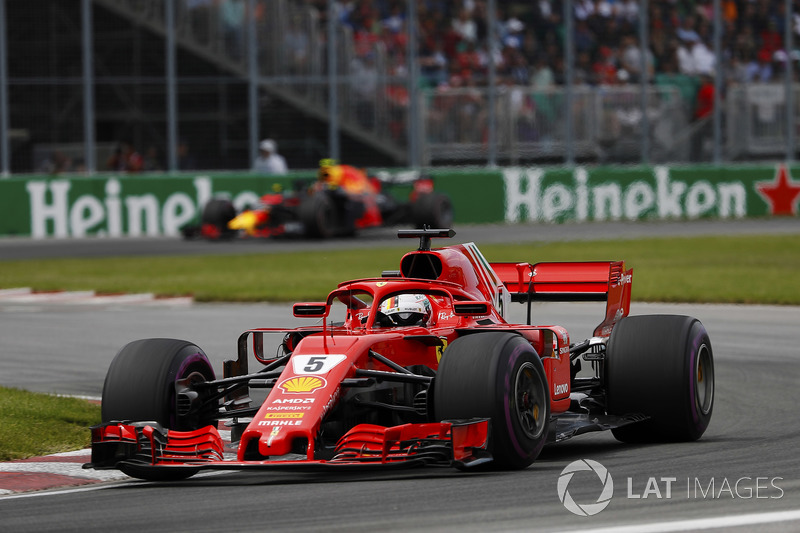 Sebastian Vettel, Ferrari SF71H, leads Max Verstappen, Red Bull Racing RB14