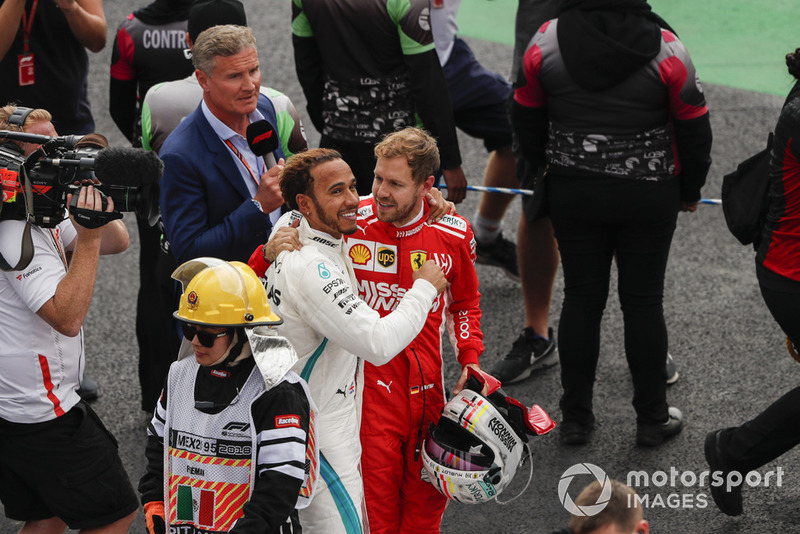 Title rival Sebastian Vettel, Ferrari, offers his congratulations to drivers championship winner Lewis Hamilton, Mercedes AMG F1