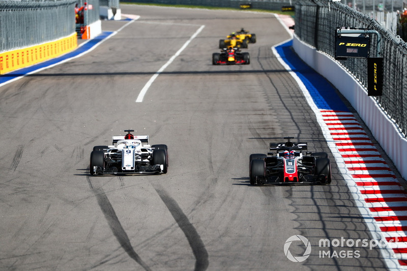 Romain Grosjean, Haas F1 Team VF-18, battles with Marcus Ericsson, Sauber C37