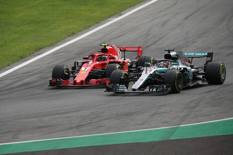 Lewis Hamilton, Mercedes AMG F1 W09 overtakes Kimi Raikkonen, Ferrari SF71H for the lead