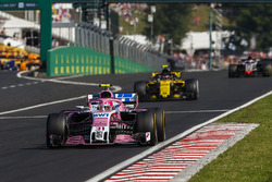 Esteban Ocon, Force India VJM11, leads Carlos Sainz Jr., Renault Sport F1 Team R.S. 18, and Romain Grosjean, Haas F1 Team VF-18