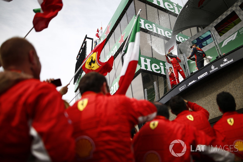 Sebastian Vettel, Ferrari, 1st position, and Max Verstappen, Red Bull Racing, 3rd position, spray Ch