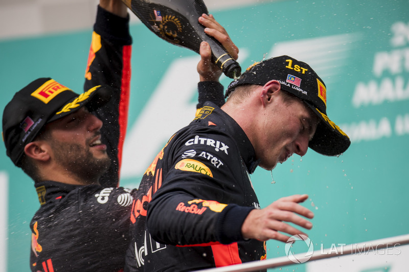 third place Daniel Ricciardo, Red Bull Racing, pours Champagne down the back of Max Verstappen, Red Bull Racing, race winner, on the podium