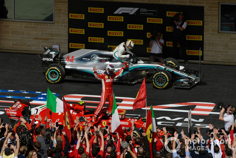 Race winner Kimi Raikkonen, Ferrari SF71H celebrates in Parc Ferme with Lewis Hamilton, Mercedes-AMG F1 W09 in back ground 