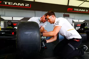 Stoffel Vandoorne, McLaren, practices changing Pirelli tyres in the Fan Zone