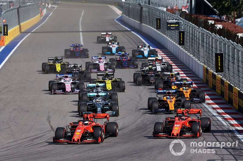 Sebastian Vettel, Ferrari SF90, leads Charles Leclerc, Ferrari SF90, Lewis Hamilton, Mercedes AMG F1 W10, Carlos Sainz Jr., McLaren MCL34, Valtteri Bottas, Mercedes AMG W10, Lando Norris, McLaren MCL34, and the rest of the field at the start