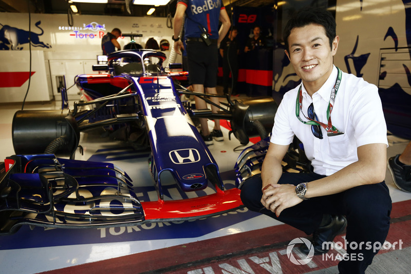 Honda driver Naoki Yamamoto poses for a picture with the Toro Rosso STR13