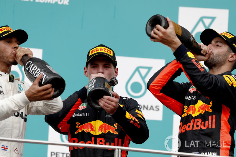 Second place Lewis Hamilton, Mercedes AMG F1, Max Verstappen, Red Bull Racing, race winner, third place Daniel Ricciardo, Red Bull Racing, drink a Champagne toast on the podium