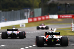 Fernando Alonso, McLaren MCL32, Pierre Gasly, Scuderia Toro Rosso STR12, leave the pits