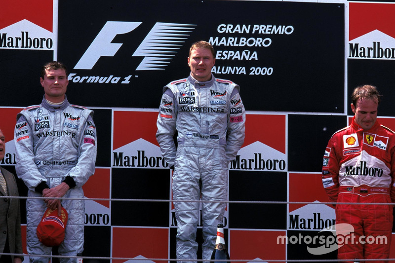 Podium: second place David Coulthard, McLaren, Race winner Mika Hakkinen, McLaren, third place Ruben