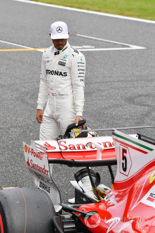 Lewis Hamilton, Mercedes AMG F1 looks at the Ferrari SF70H in parc ferme
