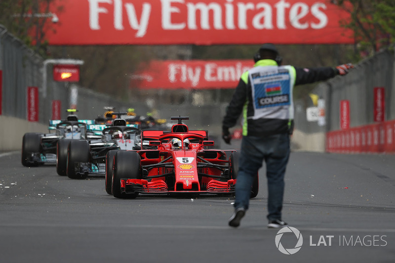 Sebastian Vettel, Ferrari SF71H and marshal