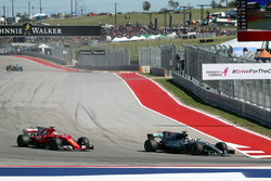 Lewis Hamilton, Mercedes AMG F1 W08 passes Sebastian Vettel, Ferrari SF70-H