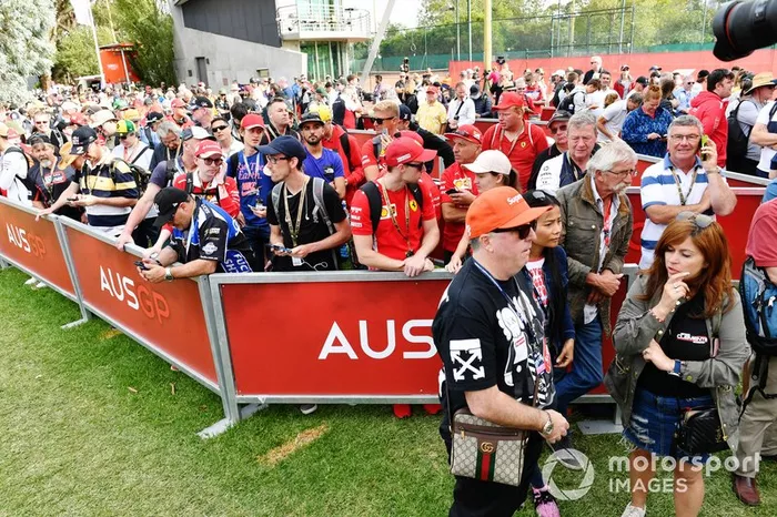 Fans queue at the delayed opening gates