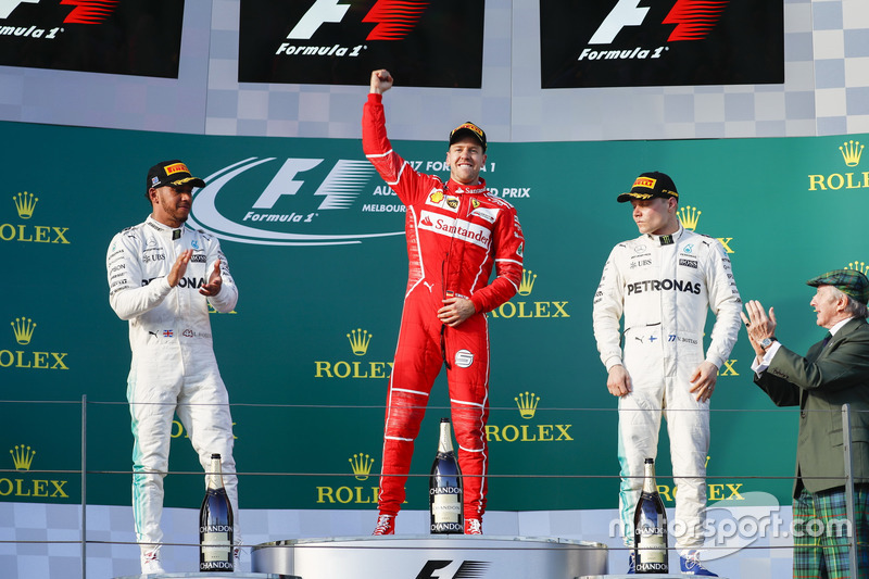 Sebastian Vettel, Ferrari, 1st Position, Lewis Hamilton, Mercedes AMG, 2nd Position, and Valtteri Bottas, Mercedes AMG, 3rd Position, celebrate on the podium