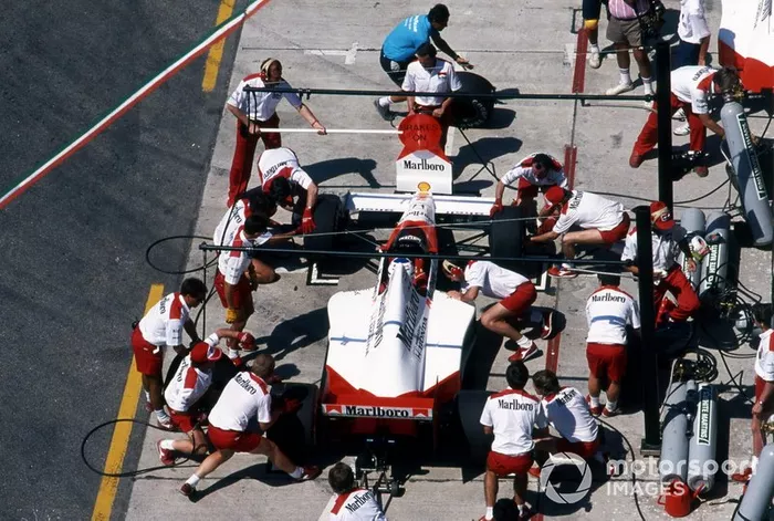 Alain Prost, McLaren MP4-5, makes a pit stop