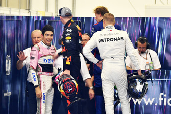 Max Verstappen, Red Bull Racing and Esteban Ocon, Racing Point Force India square up after the race following their on track crash