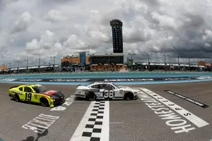 Chase Briscoe, Stewart-Haas Racing, Ford takes the checker flag ahead of Brandon Jones, Joe Gibbs Racing, Toyota Supra