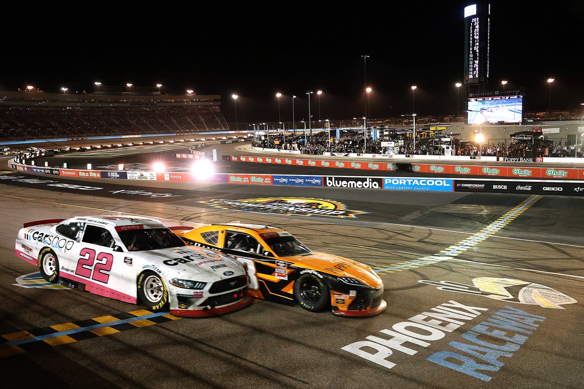 Daniel Hemric, Joe Gibbs Racing, Toyota Supra Poppy Bank crosses the finish line ahead of Austin Cindric, Team Penske, Ford Mustang CarShop